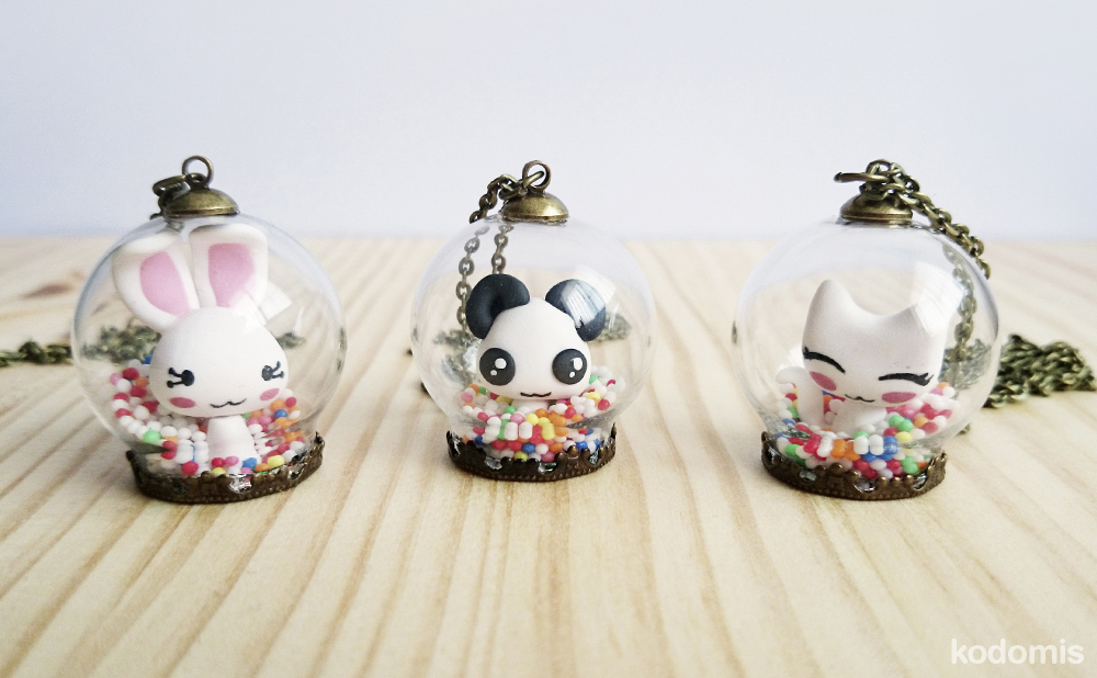 Colgante bola de cristal kawaii de conejo, panda y gato
